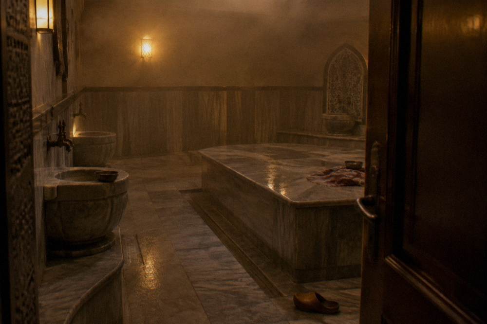 Modern hotel spa hamam room with polished stone surfaces and soft lighting