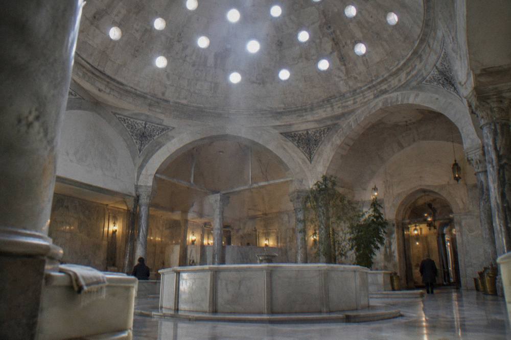 Domed Ottoman bath ceiling with small glass circles set into the masonry letting light fall onto marble