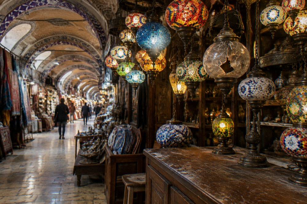 Lantern shop interior in a covered bazaar with rows of hanging glass lamps