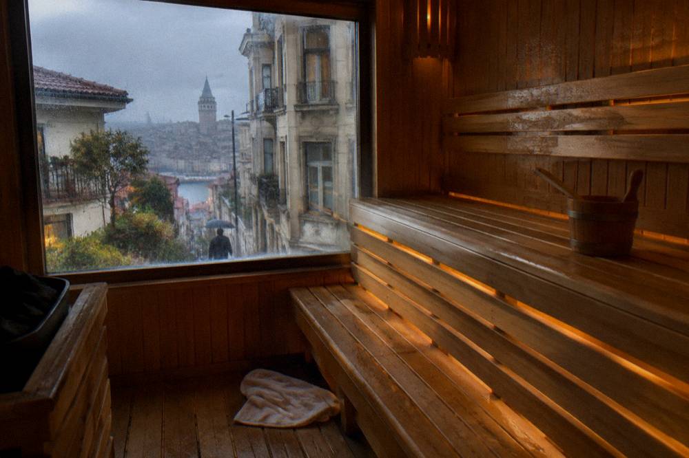 Private sauna cabin with wooden benches and warm low lighting