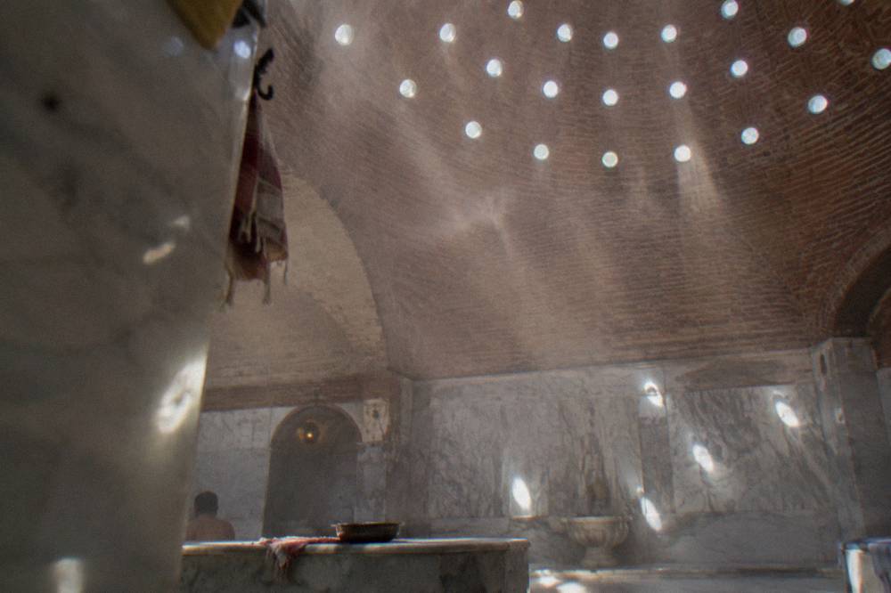Sunlight falling through the round glass discs set into a hamam dome